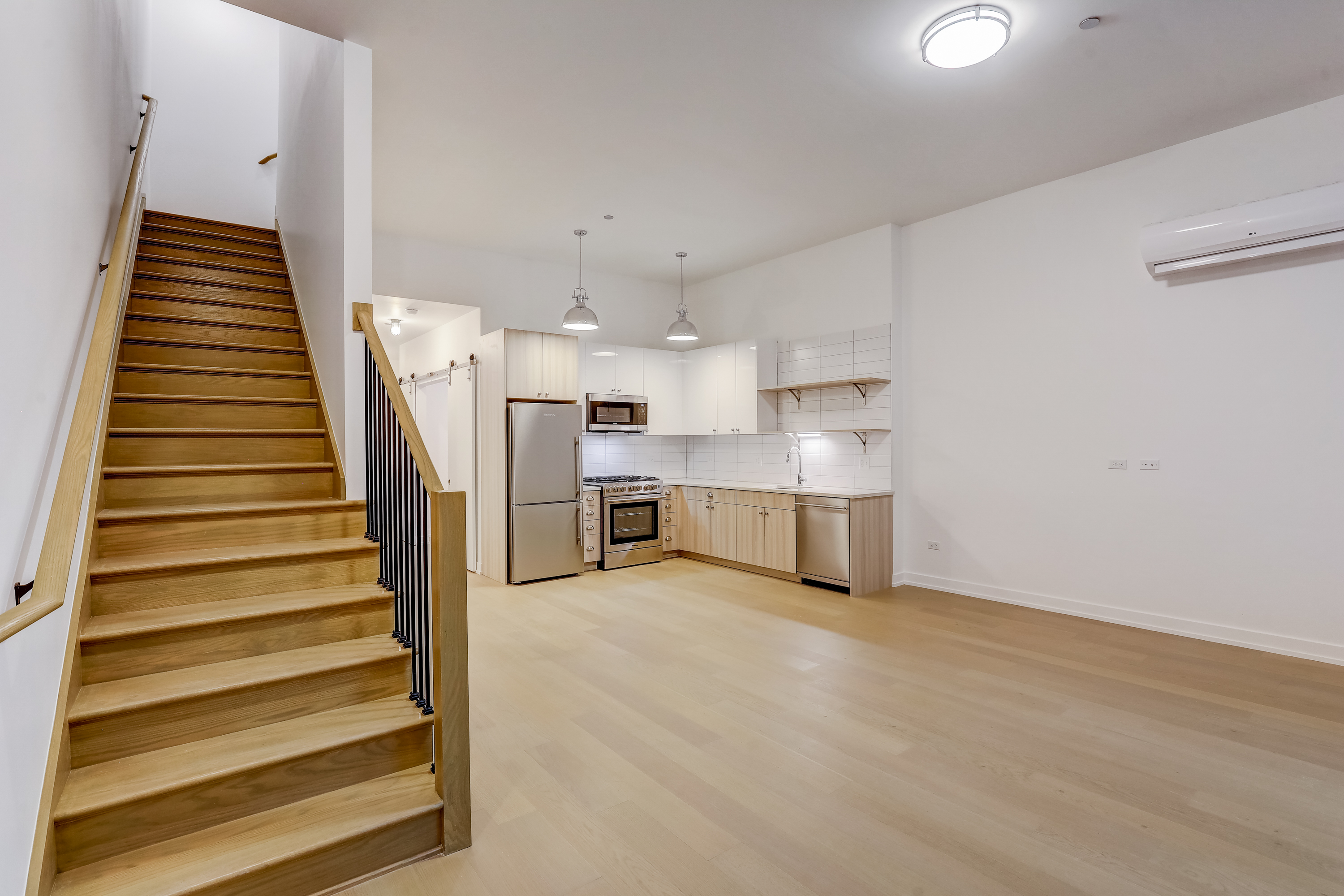 stairs leading to second floor townhouse in Chicago at The Heron apartments in Edgewater