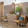 Lobby with dresser and seating area at Lobby area with blue couches and decor at The Heron apartments in Edgewater