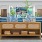 Lobby area with blue couches and decor at The Heron apartments in Edgewater