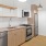 Kitchen with wood flooring and stainless steel appliances