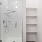 Bathroom with white tiled glass shower