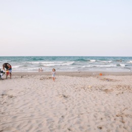 The Heron sits directly in between both Osterman Beach & Foster Beach. a beach front with people walking