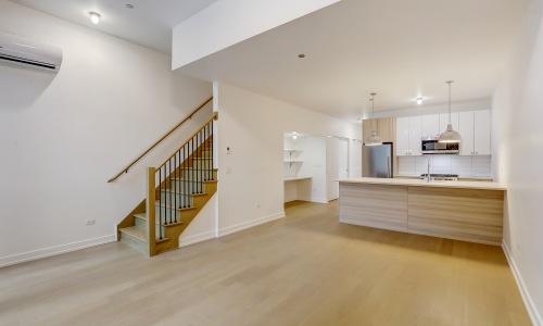 Kitchen with wood flooring and stainless steel appliances